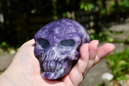 Elongated lepidolite traveller skull carve