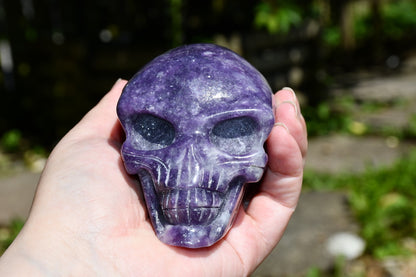 Elongated lepidolite traveller skull carve