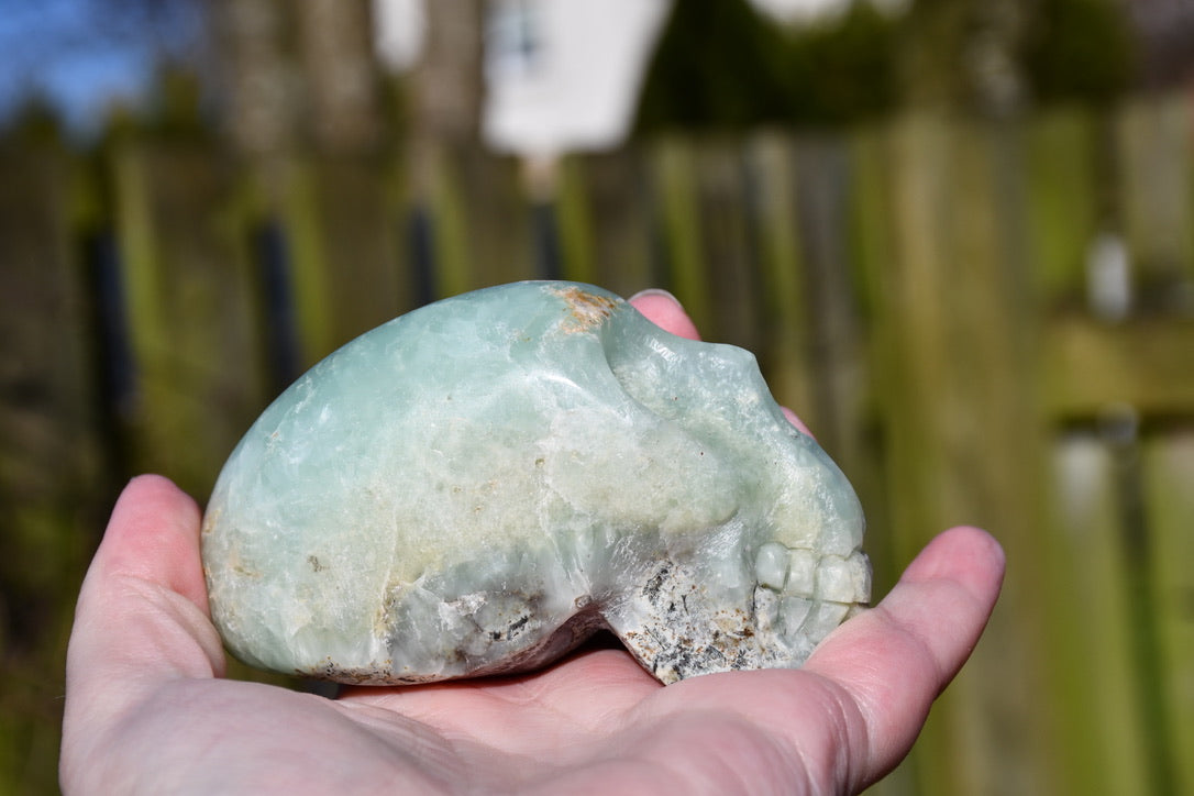 Namibian prehnite traveller skull - Manus carve